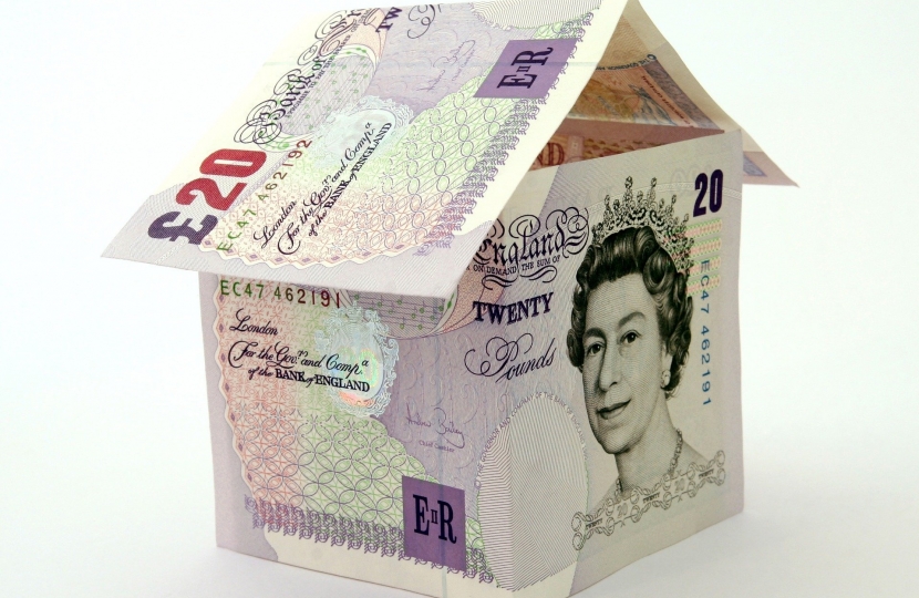 British money shaped into a house