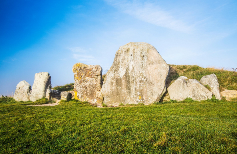 Sarsen stones at sunrise in Avebury, Wiltshire.