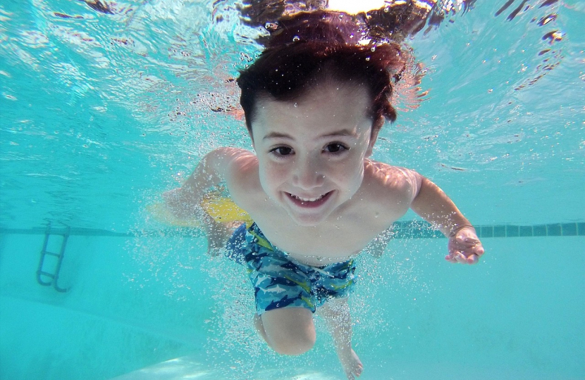 Child swimming in swimming pool