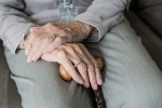 Elderly hands in lap