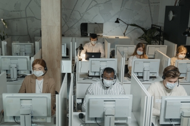 Call centre workers wearing coronavirus masks