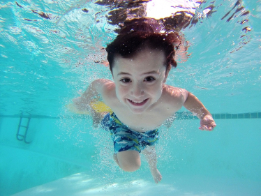 Child swimming in swimming pool